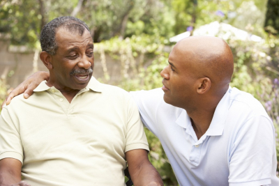 caregiver and senior man talking