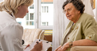 caregiver interviewing a senior woman